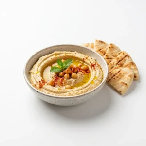 Fresh hummus served with warm pita bread at Halal Crispy Bites in Baltimore