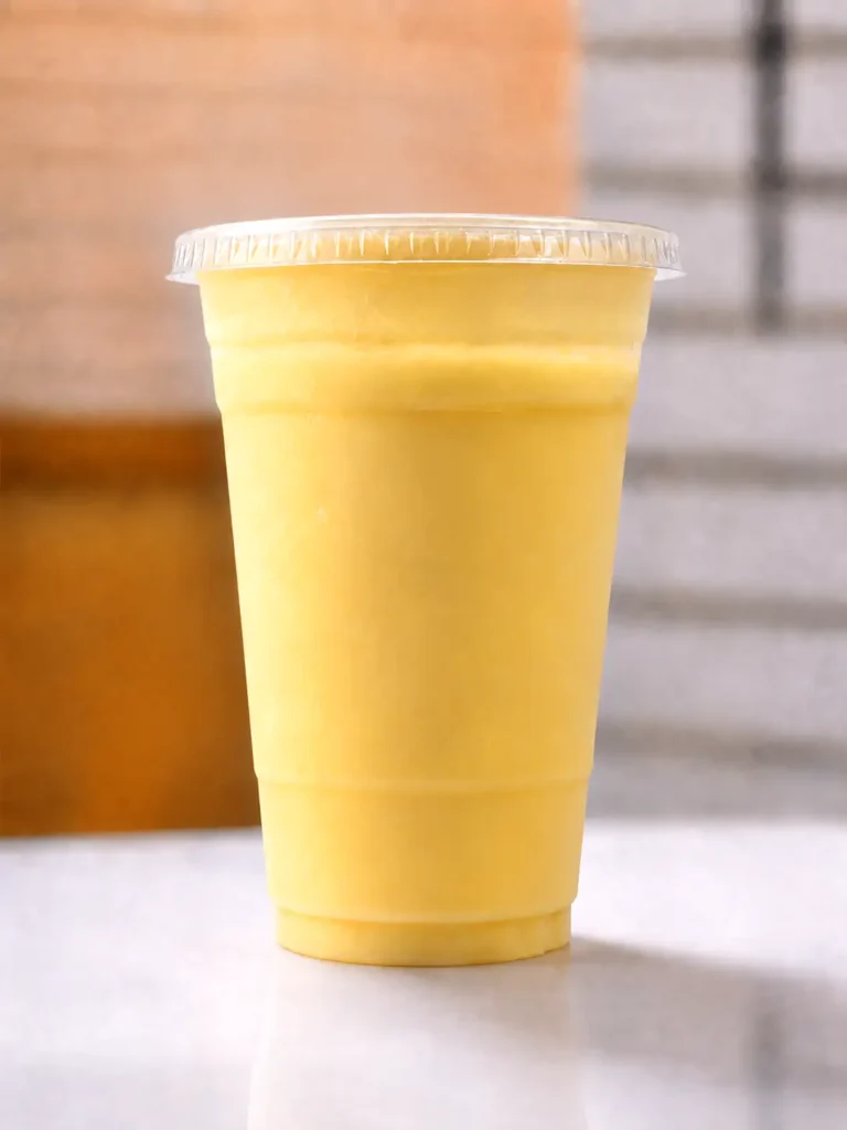 Sweet Mango Lassi made with ripe mangoes and fresh yogurt at Halal Crispy Bites in Baltimore